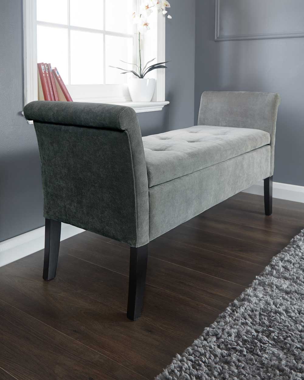 This storage bench is upholstered in beautiful grey chenille fabric. Concealing deep-tufted seating which emphasises the bench's crisp profile. Seating up to 2 persons, this bench is not only practical but stylish.