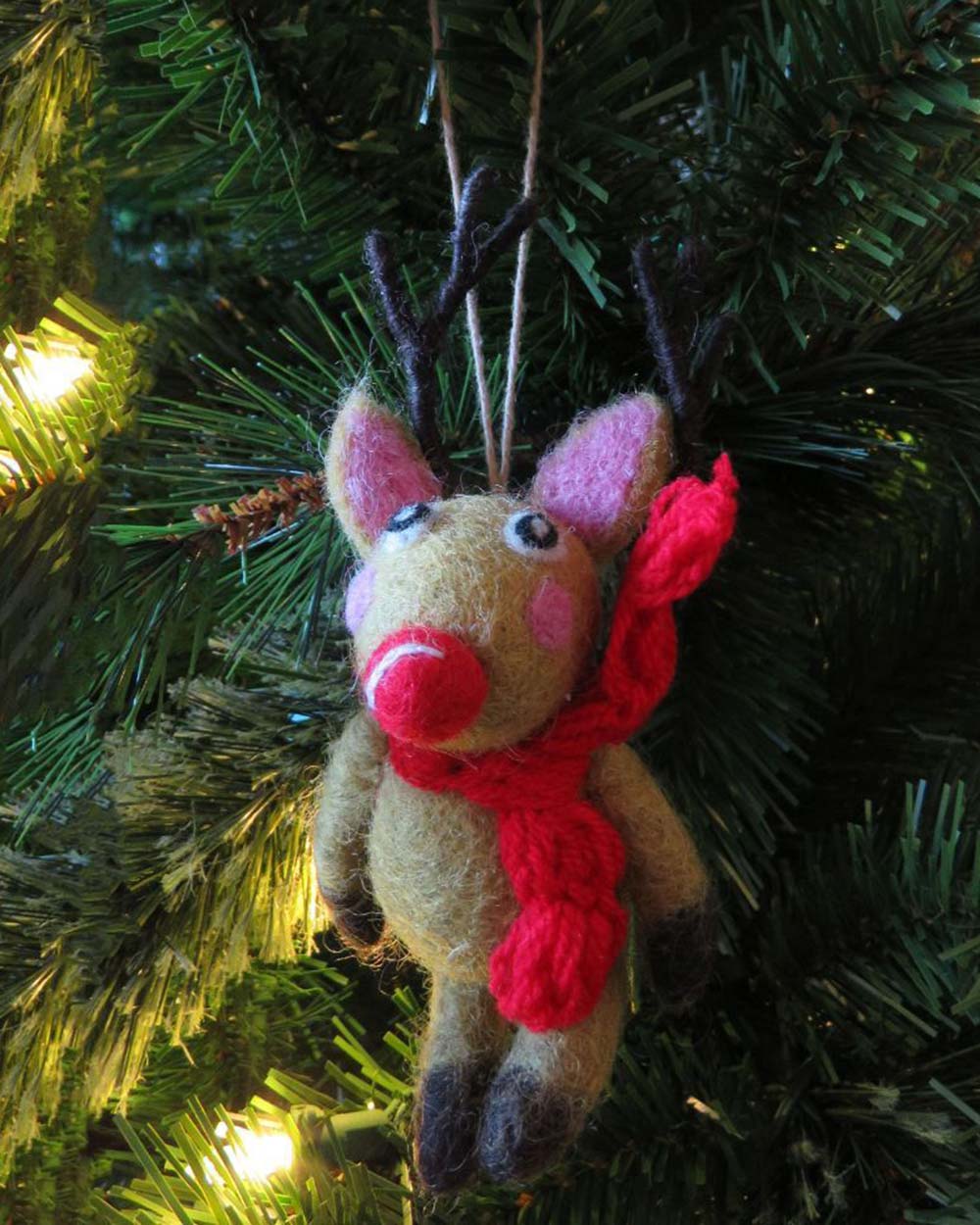 This adorable felt reindeer will definitely put a smile on your face. So, put on those Christmas songs, and happily decorate your tree! Made from 100% Wool with no plastic or glue in sight! This little character is charming in every single way.