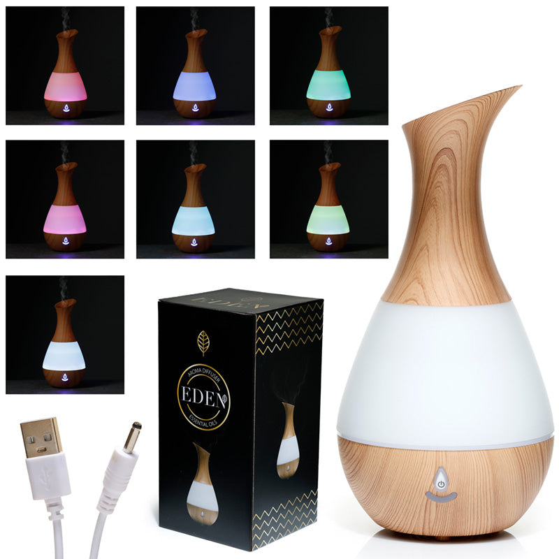 Sooth your senses with this glorious colour changing USB Aroma Diffuser! This aroma diffuser has a modern compact design in stylish white and wood effect with seven vibrant changing colours. With an ultrasonic plate in the base that vibrates turning the water and oil mix into an aromatic mist. When inhaled it can aid relaxation and mindfulness and can be used during meditation and yoga.