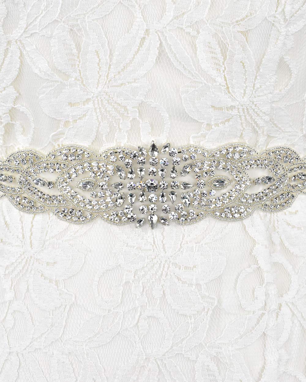 This wedding belt is bound to make a statement and give the wow factor to your dress. This diamante wide belt is adorned with stunning rhinestone diamantes and beading detail. Displayed on an 66" organza ribbon to easily tie around your waist. Adding luscious sparkle to any wedding dress.