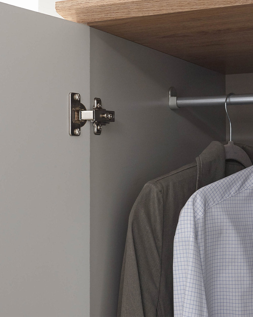 A 3 door wardrobe in modern subtle grey offers ample storage space and elegant brushed steel handles. The wardrobe opens to reveal hanging space and a convenient shelf. It also features three drawers with cup handles. The muted grey colour complements any interior style and contrasts with the oak-effect top. The wardrobe is aesthetically pleasing and sturdy, with a deep base plinth. It comes flat packed for self-assembly. Delivery is available only to mainland UK, excluding certain postcodes.