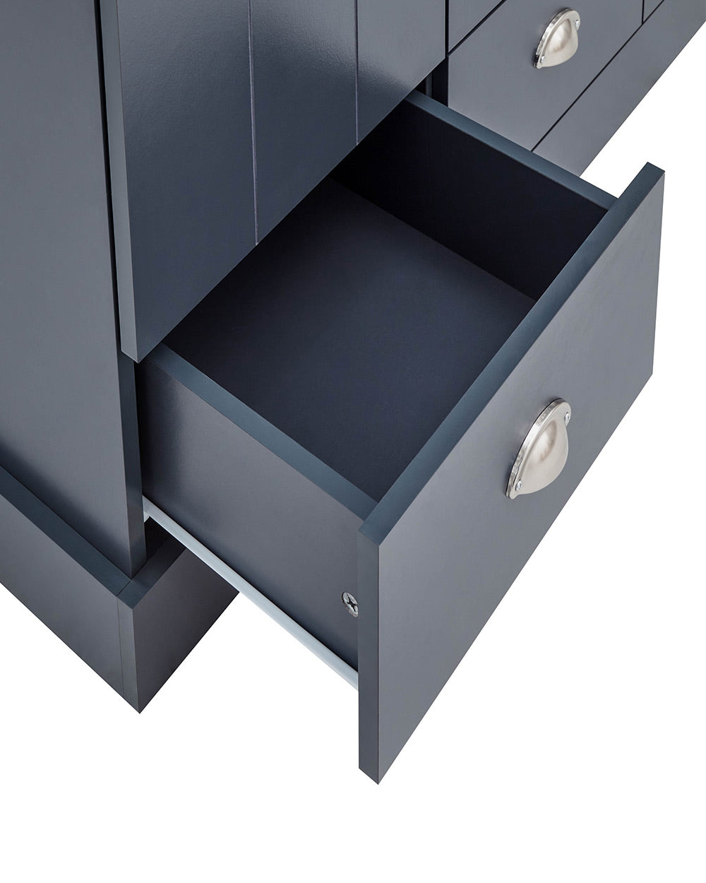 A 3 door wardrobe in modern slate blue offers ample storage space and elegant brushed steel handles. The wardrobe opens to reveal hanging space and a convenient shelf. It also features three drawers with cup handles. The bold slate blue colour complements any interior style and contrasts with the oak-effect top. The wardrobe is aesthetically pleasing and sturdy, with a deep base plinth. It comes flat packed for self-assembly. Delivery is available only to mainland UK, excluding certain postcodes.