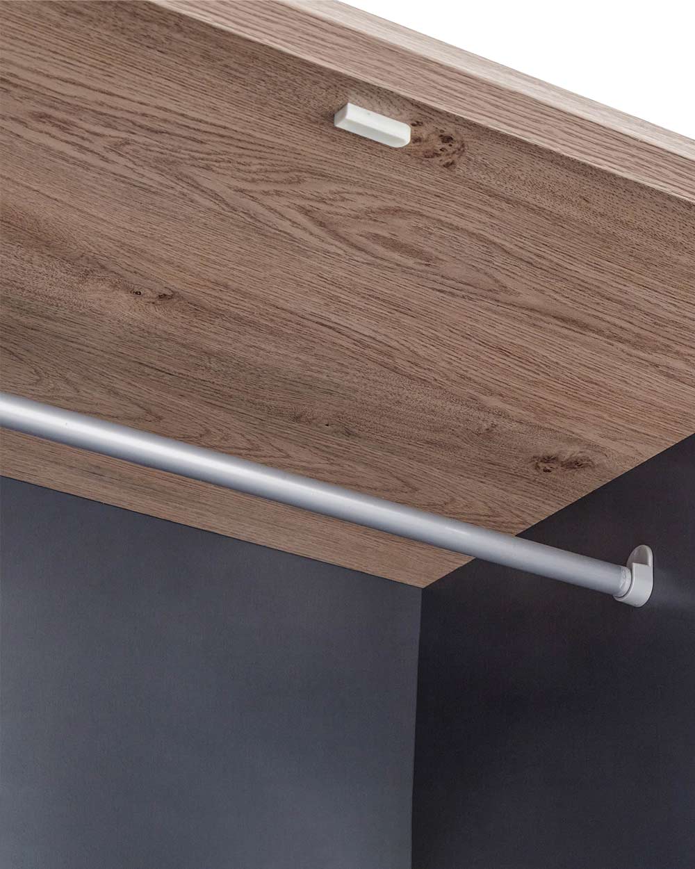 A 3 door wardrobe in modern slate blue offers ample storage space and elegant brushed steel handles. The wardrobe opens to reveal hanging space and a convenient shelf. It also features three drawers with cup handles. The bold slate blue colour complements any interior style and contrasts with the oak-effect top. The wardrobe is aesthetically pleasing and sturdy, with a deep base plinth. It comes flat packed for self-assembly. Delivery is available only to mainland UK, excluding certain postcodes.