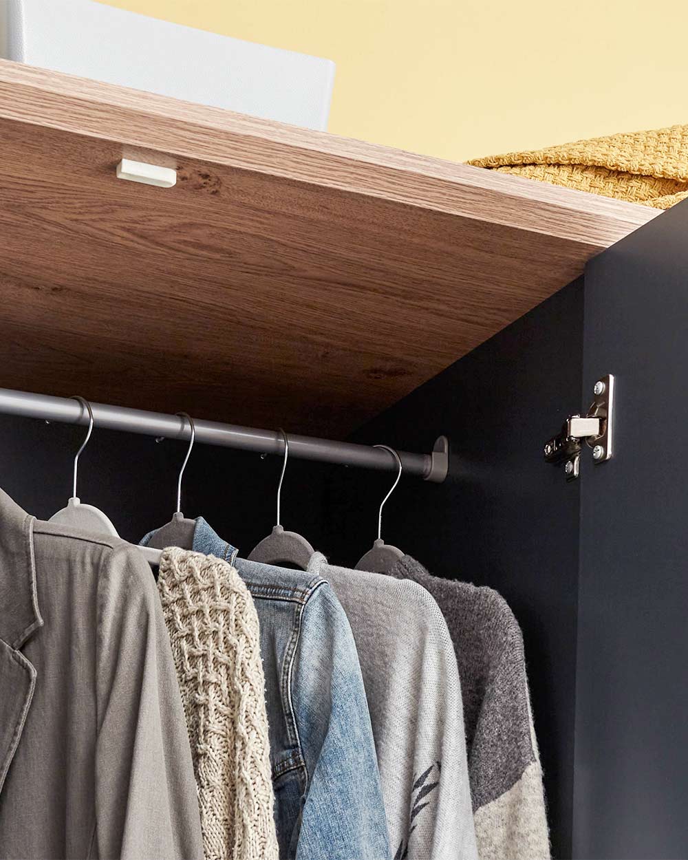 A 3 door wardrobe in modern slate blue offers ample storage space and elegant brushed steel handles. The wardrobe opens to reveal hanging space and a convenient shelf. It also features three drawers with cup handles. The bold slate blue colour complements any interior style and contrasts with the oak-effect top. The wardrobe is aesthetically pleasing and sturdy, with a deep base plinth. It comes flat packed for self-assembly. Delivery is available only to mainland UK, excluding certain postcodes.