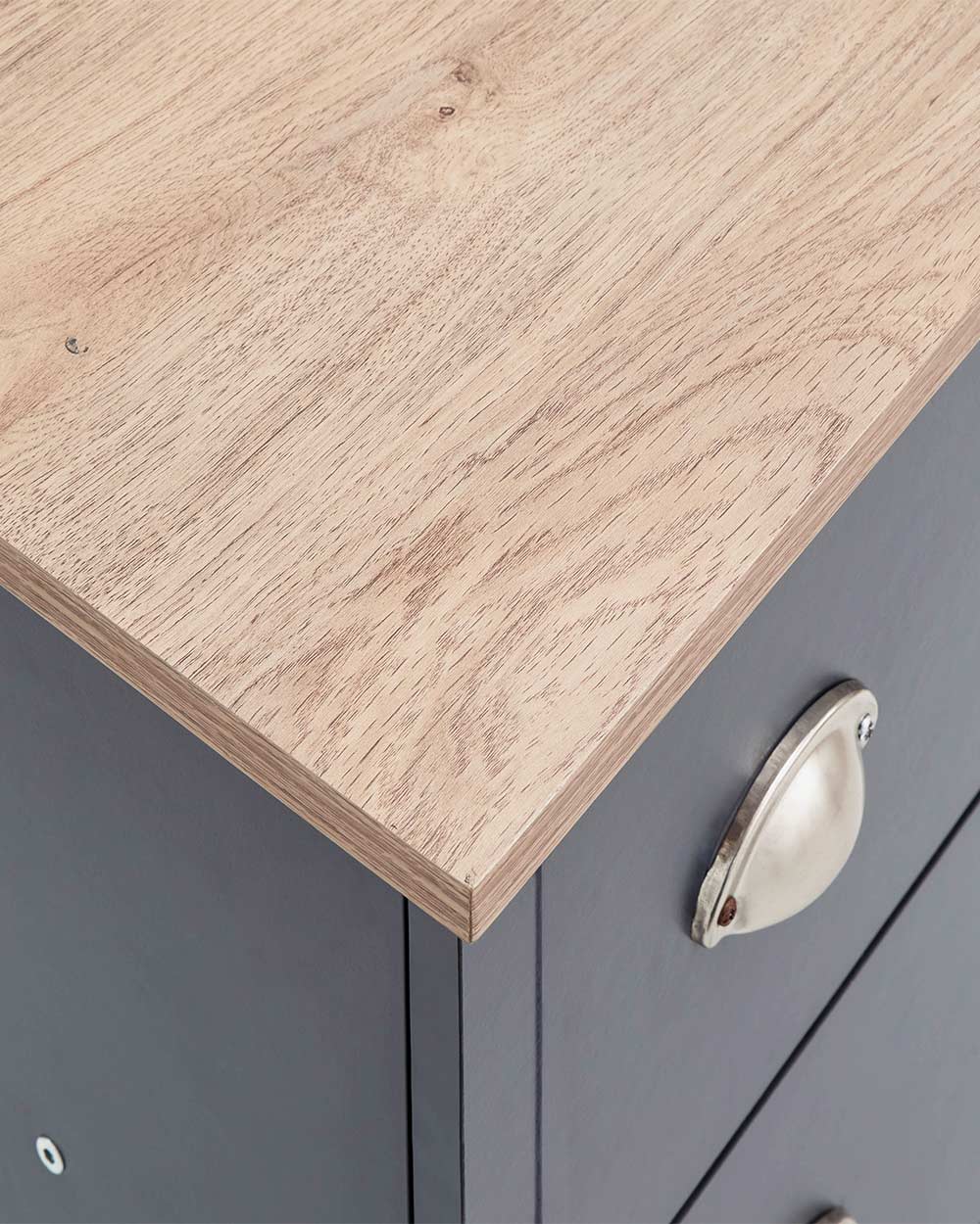 A modern grey chest of drawers with 3 drawers. Generous storage space for clothes and accessories. Features brushed steel cup handles and easy glide metal runners. Sturdy structure with a bevelled oak-effect top. Flat packed for home assembly. Perfect for adding a personal touch to your room.
