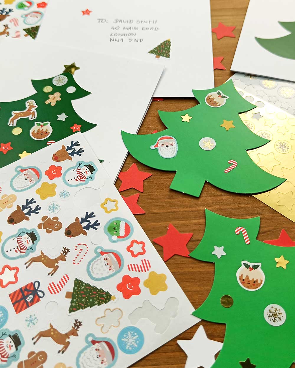 Inside this kit, you'll find 10 high-quality Christmas tree-shaped cards. With 5 light green and 5 dark green trees, you'll have the perfect canvas to create stunning, personalised cards. Accompanying these charming cards are 10 white envelopes, ensuring your heartfelt creations have the perfect finishing touch. With an array of 140 jolly festive stickers, from candy canes to gingerbread men, snowmen to Santa Claus, reindeer to presents and more! and 110 gold stickers