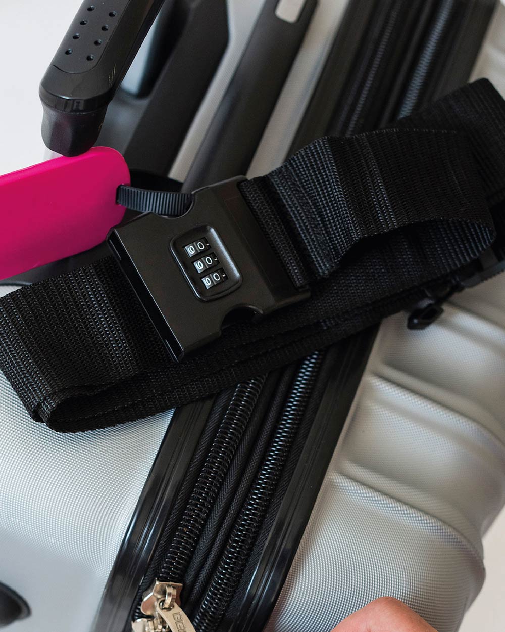 lifestyle image of the combination luggage belt on a suitcase