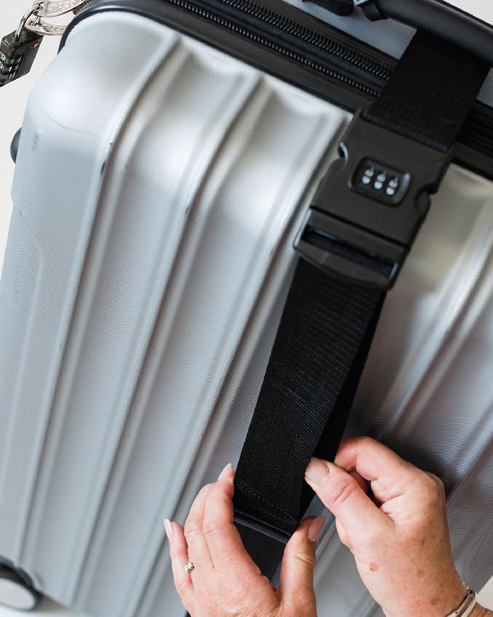 lifestyle image of the combination luggage belt in use on a suitcase