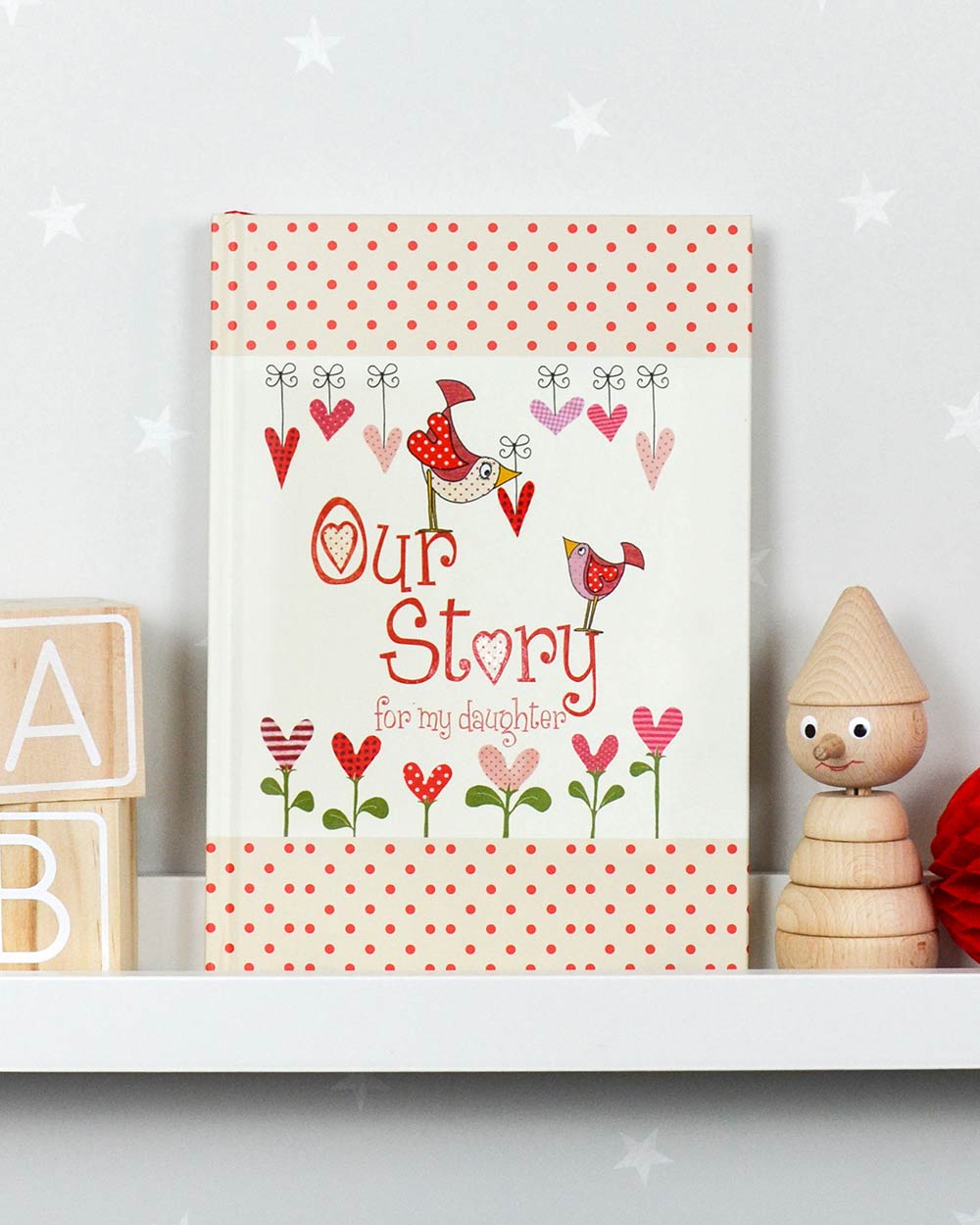 our story from you to me daughter journal memory book lifestyle photo of the inside front cover stood up on a nursery shelf