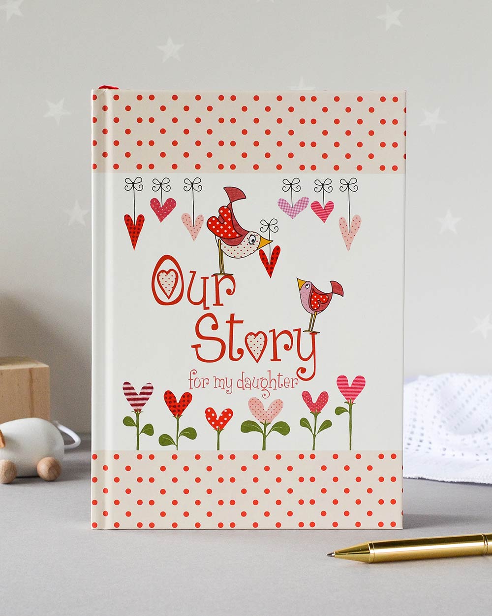 our story from you to me daughter journal memory book lifestyle photo of the inside front cover stood up on a nursery shelf