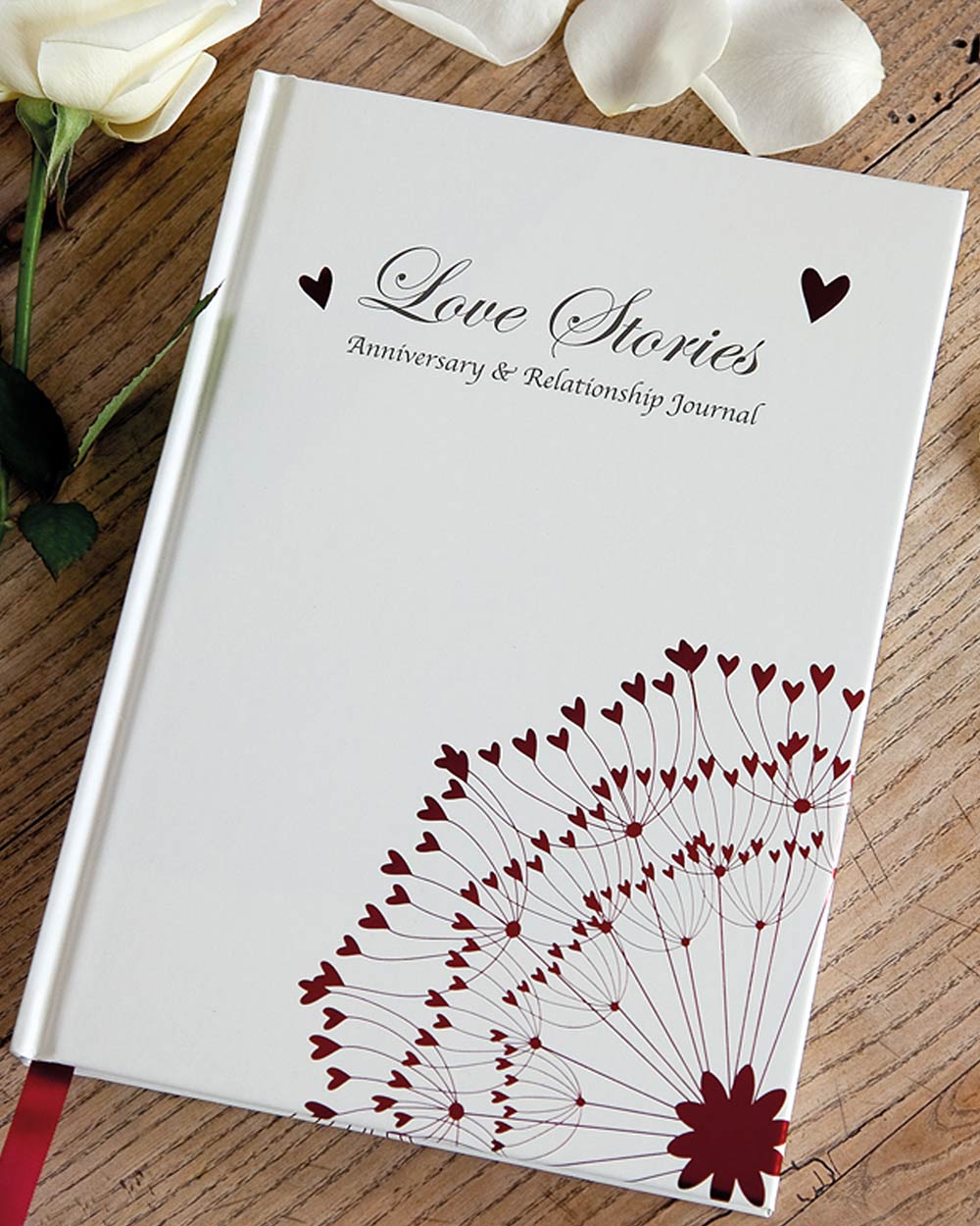 Memory book journal love stories from you to me great for an anniversary or wedding gift. Lifestyle image of the book lying down