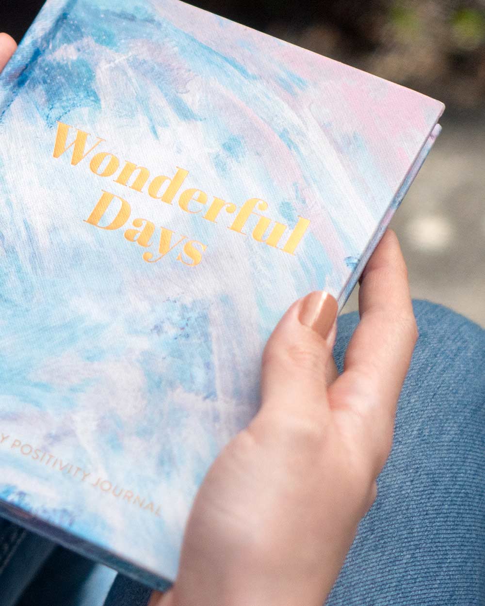 wonderful days journal, diary positivity mental health awareness. Photo of someone holding the journal.