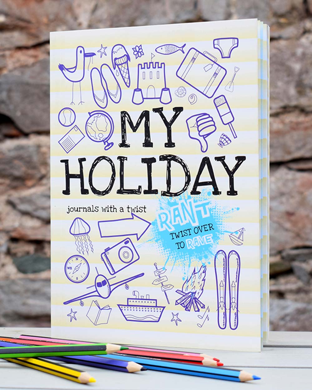 My holiday kids activity book rant and rave journal. Pictured standing up on a table with colouring pencils in front