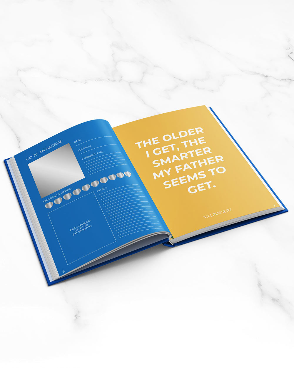 100 Things To Do With Dad Scratch Book Activity open book on marble table