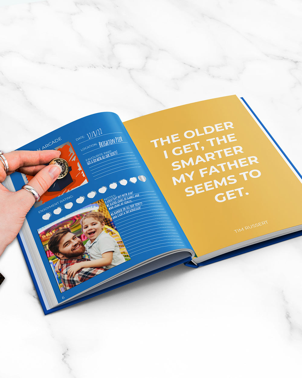 100 Things To Do With Dad Scratch Book Activity open book on a marble surface