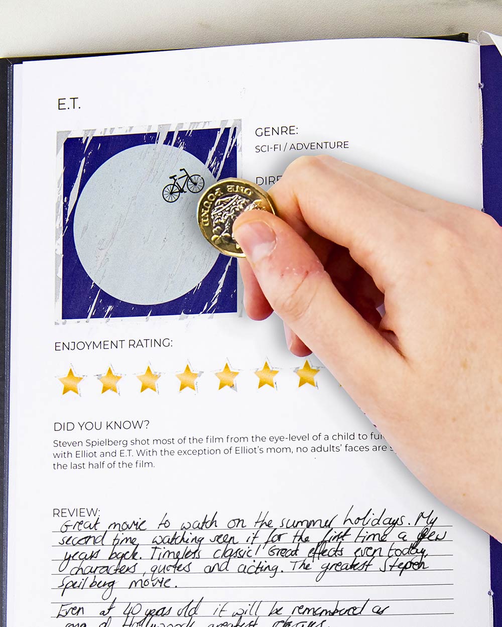 100 Movies Bucket List Scratch Book Activity being scratched off showing the film ET