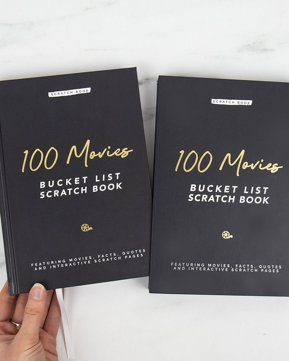 100 Movies Bucket List Scratch Book Activity with the book displayed outside the sleeve