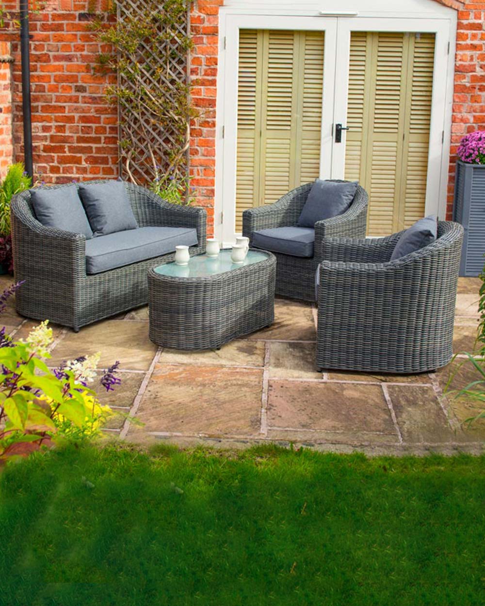 rattan garden furniture set, displayed on a patio