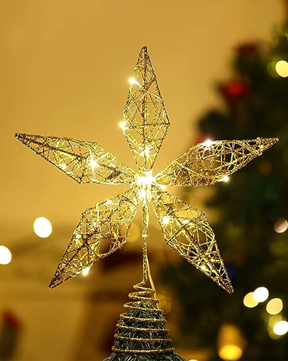 This light-up gold star Christmas tree topper is perfect for Christmas trees of all sizes. It is also a perfect topper to go with other ornaments or decorations. Creating a romantic and festive atmosphere. This Christmas tree topper is made of high-quality iron wire, with the shape of a pentagram like a diamond. The tree topper can be attached securely to your Christmas tree with the sturdy spiral base. Easy to install. It is a quick and easy way to get your home ready for the holidays.
