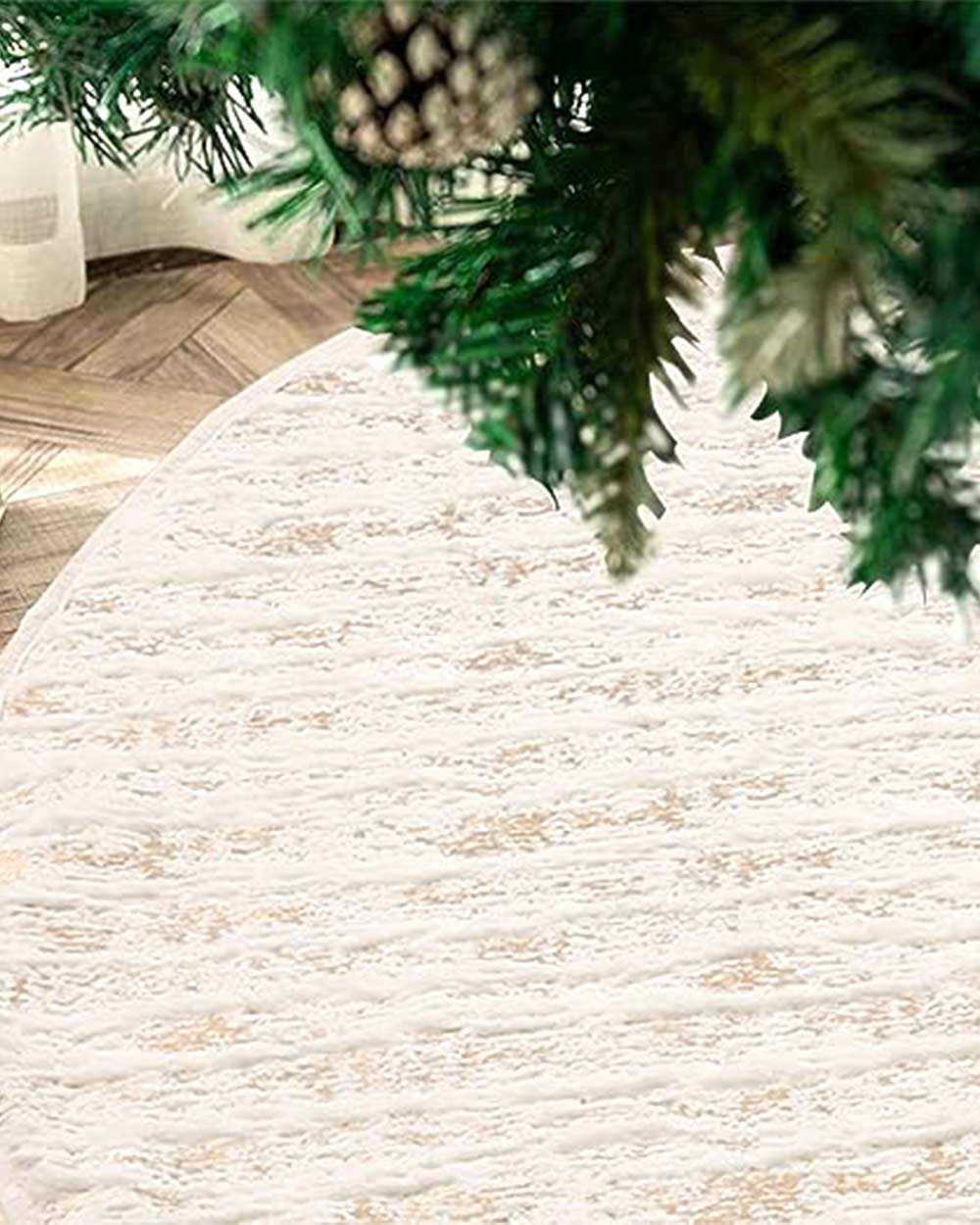 Perfect for hiding away unsightly legs, trunks, or stands. It's great for keeping things neat and tidy by hiding all those wires and adapter plugs for your tree lights. This Christmas tree skirt is made from plush white faux fur material with sparkling gold thread throughout. It's durable and can be used year after year. Machine washable. It measures 48 inches in diameter and fits most sizes of trees.