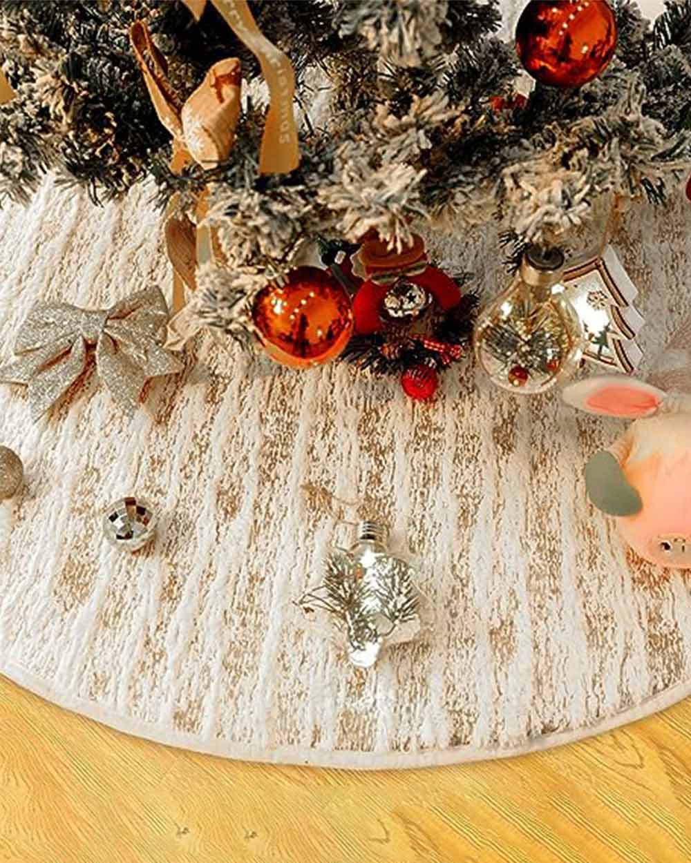 Perfect for hiding away unsightly legs, trunks, or stands. It's great for keeping things neat and tidy by hiding all those wires and adapter plugs for your tree lights. This Christmas tree skirt is made from plush white faux fur material with sparkling gold thread throughout. It's durable and can be used year after year. Machine washable. It measures 48 inches in diameter and fits most sizes of trees.