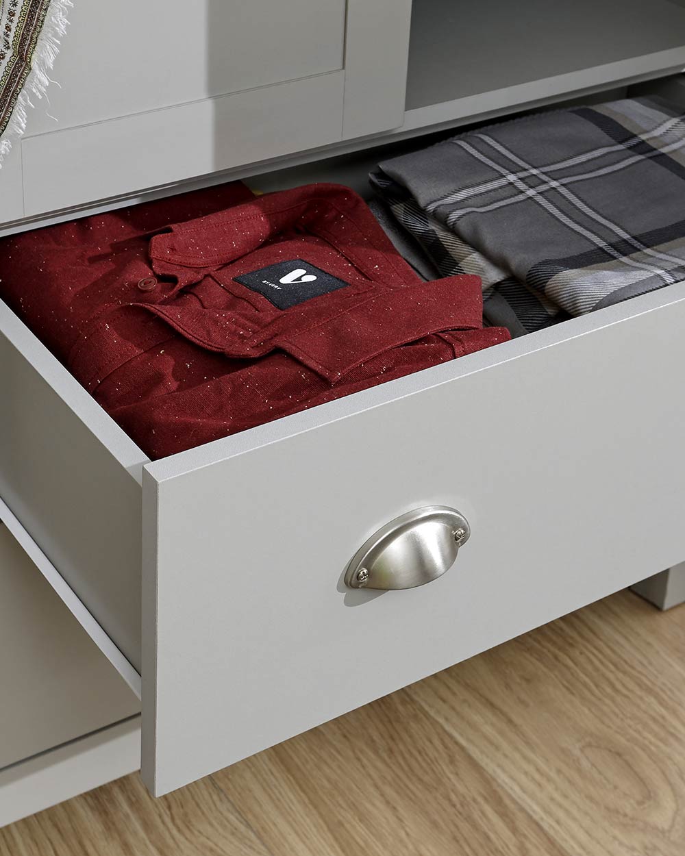 Lancaster 2 Door 2 Drawer wardrobe in sleek grey with an oak effect top in a bedroom setting close up of the drawer