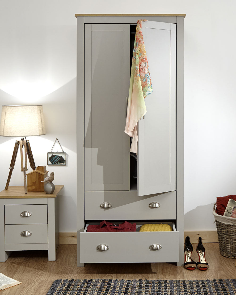 Lancaster 2 Door 2 Drawer wardrobe in sleek grey with an oak effect top in a bedroom setting with the door open and drawer open