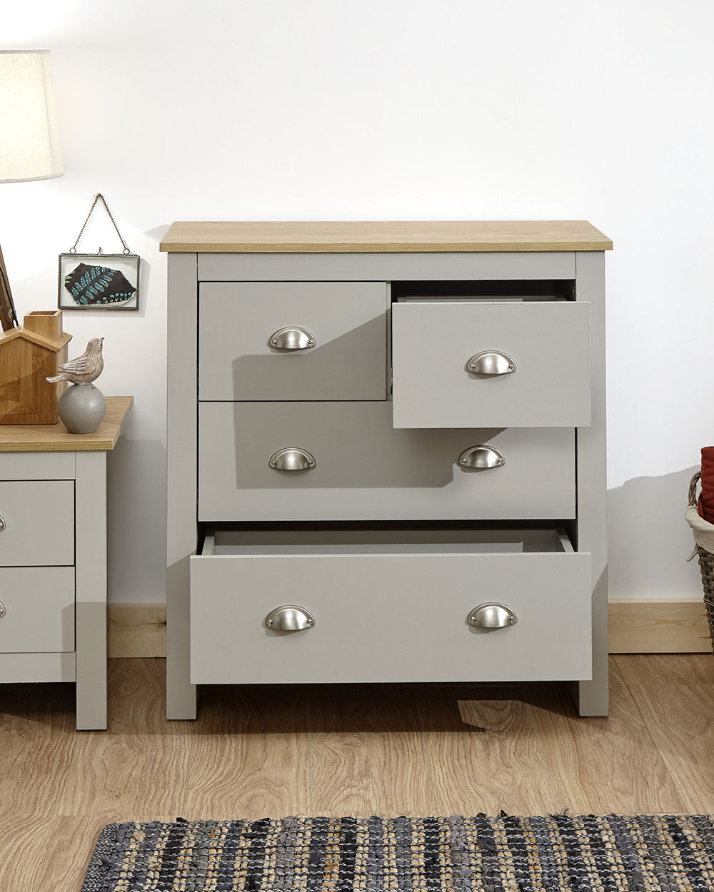 Lancaster 2 + 2 chest of drawers in grey in a lifestyle scene in a bedroom with drawers open