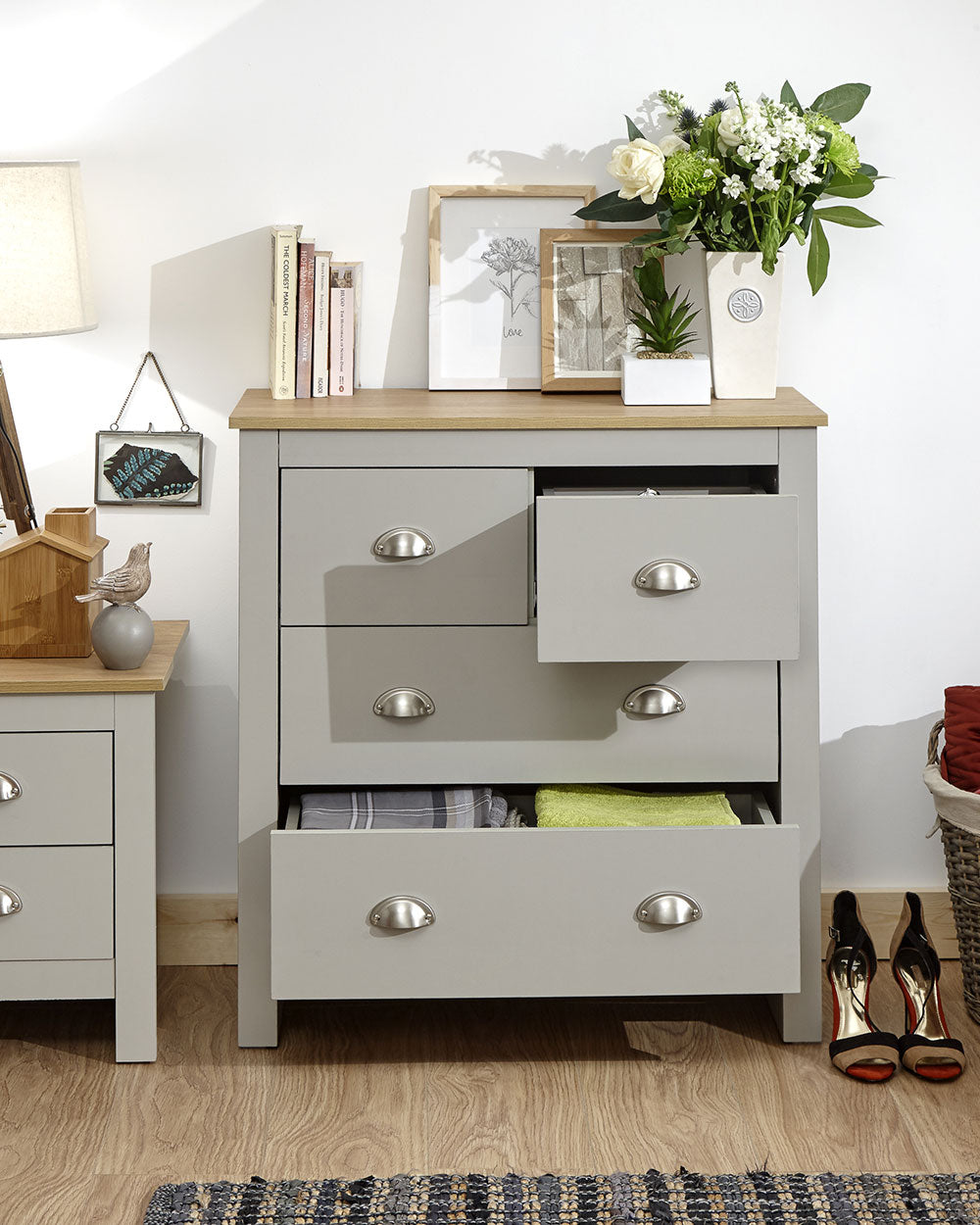 Lancaster 2 + 2 chest of drawers in grey in a lifestyle scene in a bedroom with drawers open