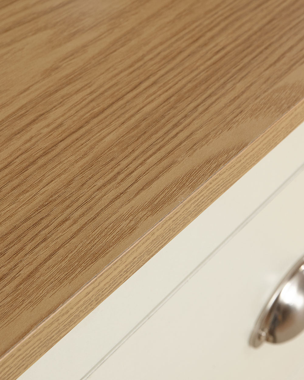 Lancaster 2 + 2 chest of drawers in cream with an oak effect top with all drawers open on a white cut out background close up of the oak effect top