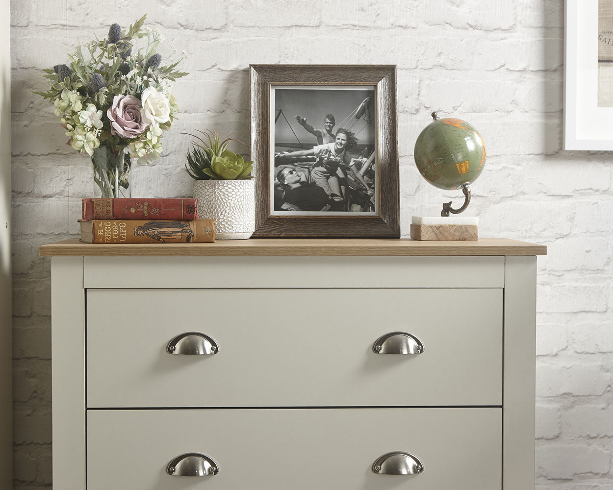 lancaster 3 piece bedroom set in cream with oak effect tops close up of the drawers in a lifestyle setting