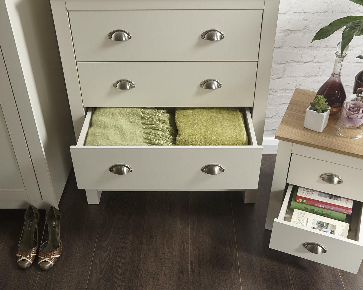 lancaster 3 piece bedroom set in cream with oak effect tops close up of the bedside table and drawers in a lifestyle setting