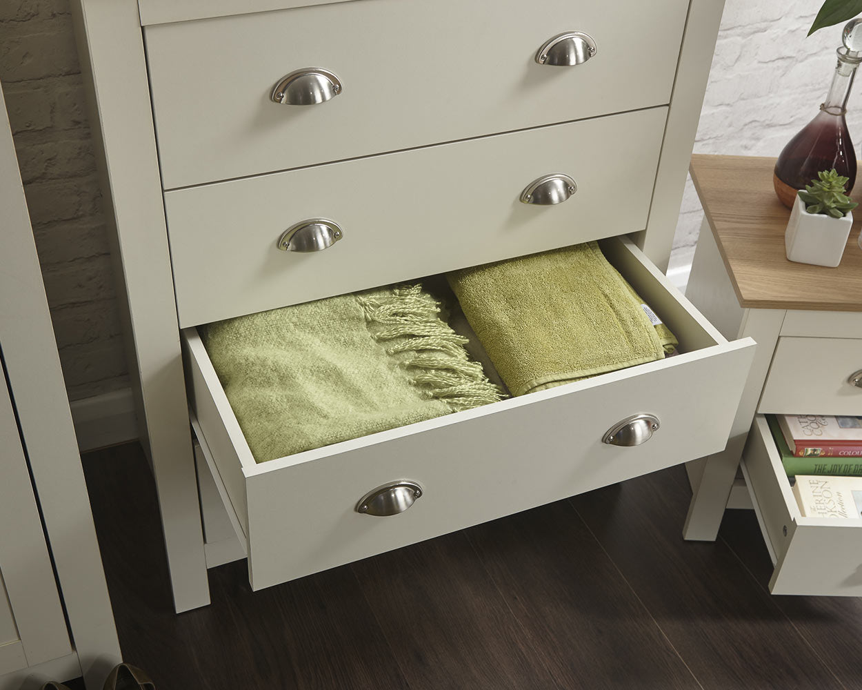 lancaster 3 piece bedroom set in cream with oak effect tops close up of the drawers in a lifestyle setting