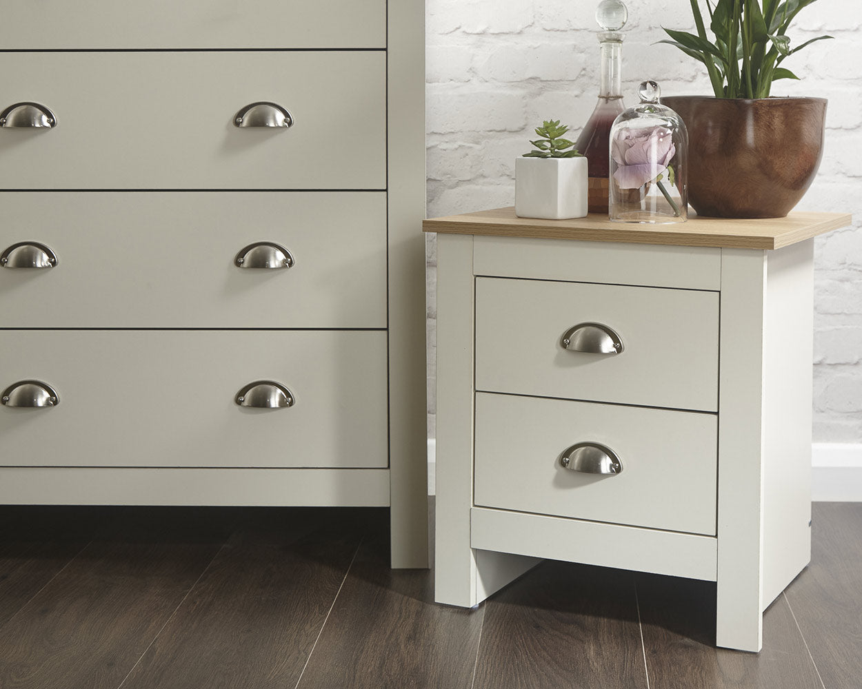 lancaster 3 piece bedroom set in cream with oak effect tops close up of the bedside table in a lifestyle setting