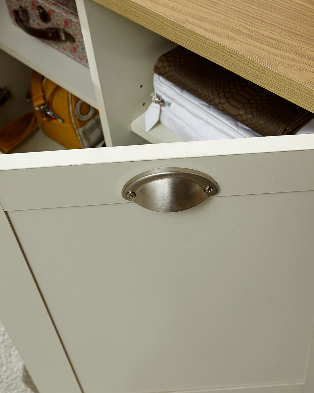 Lancaster shoe storage cabinet hallway porch or living room. Shaker style in a lifestyle scene close up of the door and handle