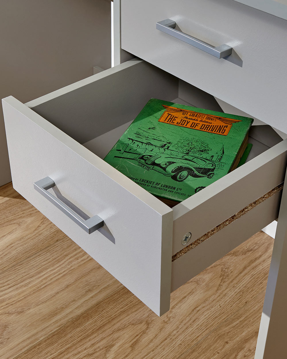 Panama desk in grey in a lifestyle photo in a room with the drawer open
