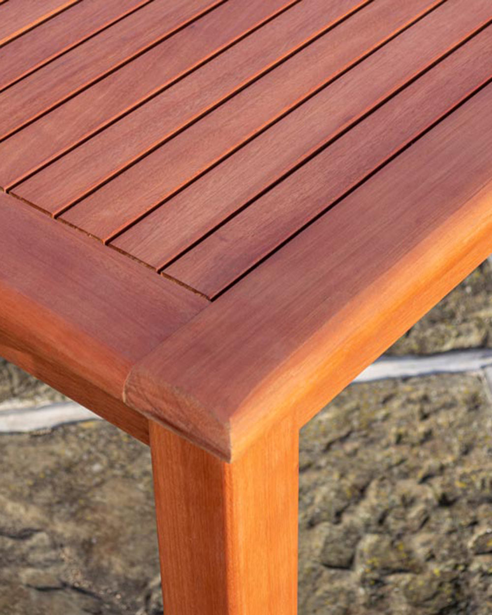 close up of the rounded corners of the wooden garden furniture table