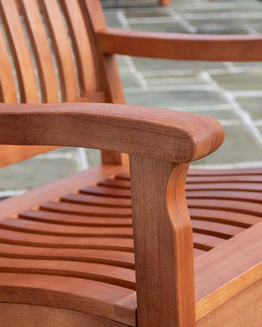 close up of the arm rests on this wooden garden furniture