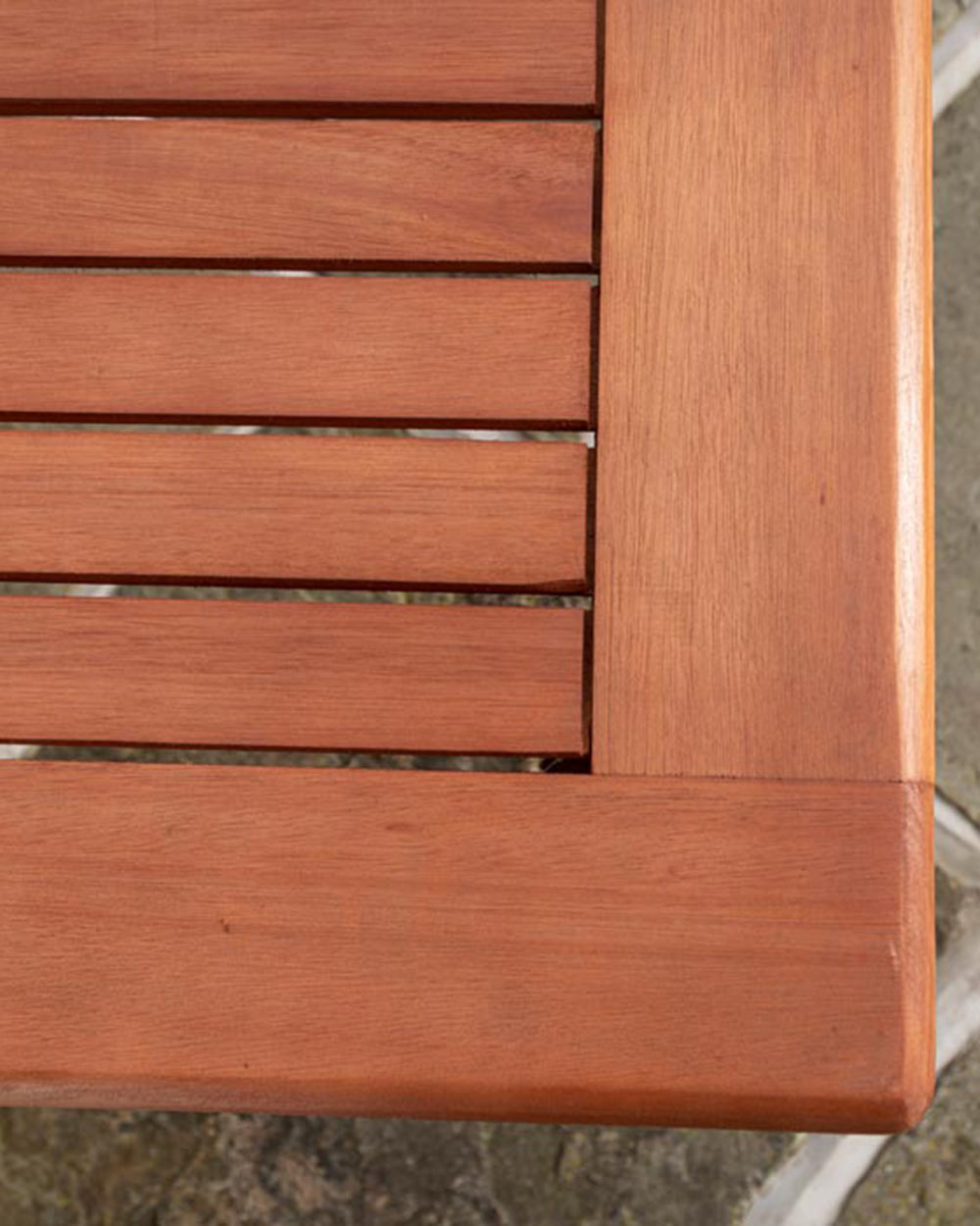 wooden garden table, close up of the curved corners and finish