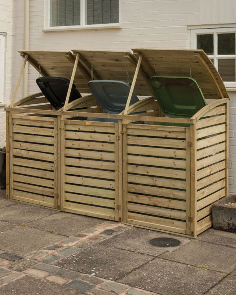 triple wheelie bin storage shed displayed outside someone's home with all bins inside and the lids lifted