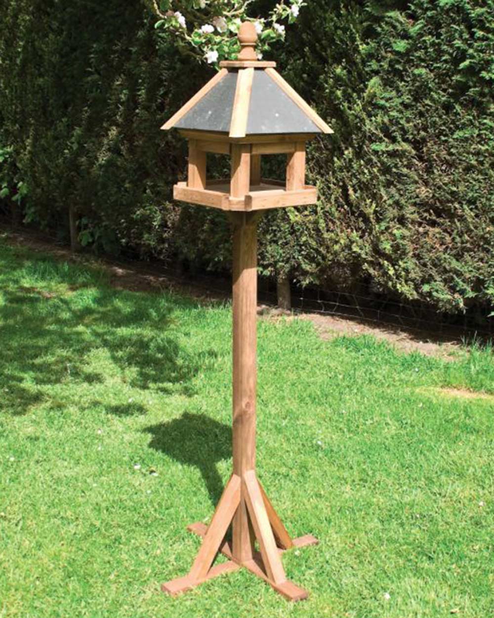 Rowlinson Laverton Bird Table built pictured in a a garden