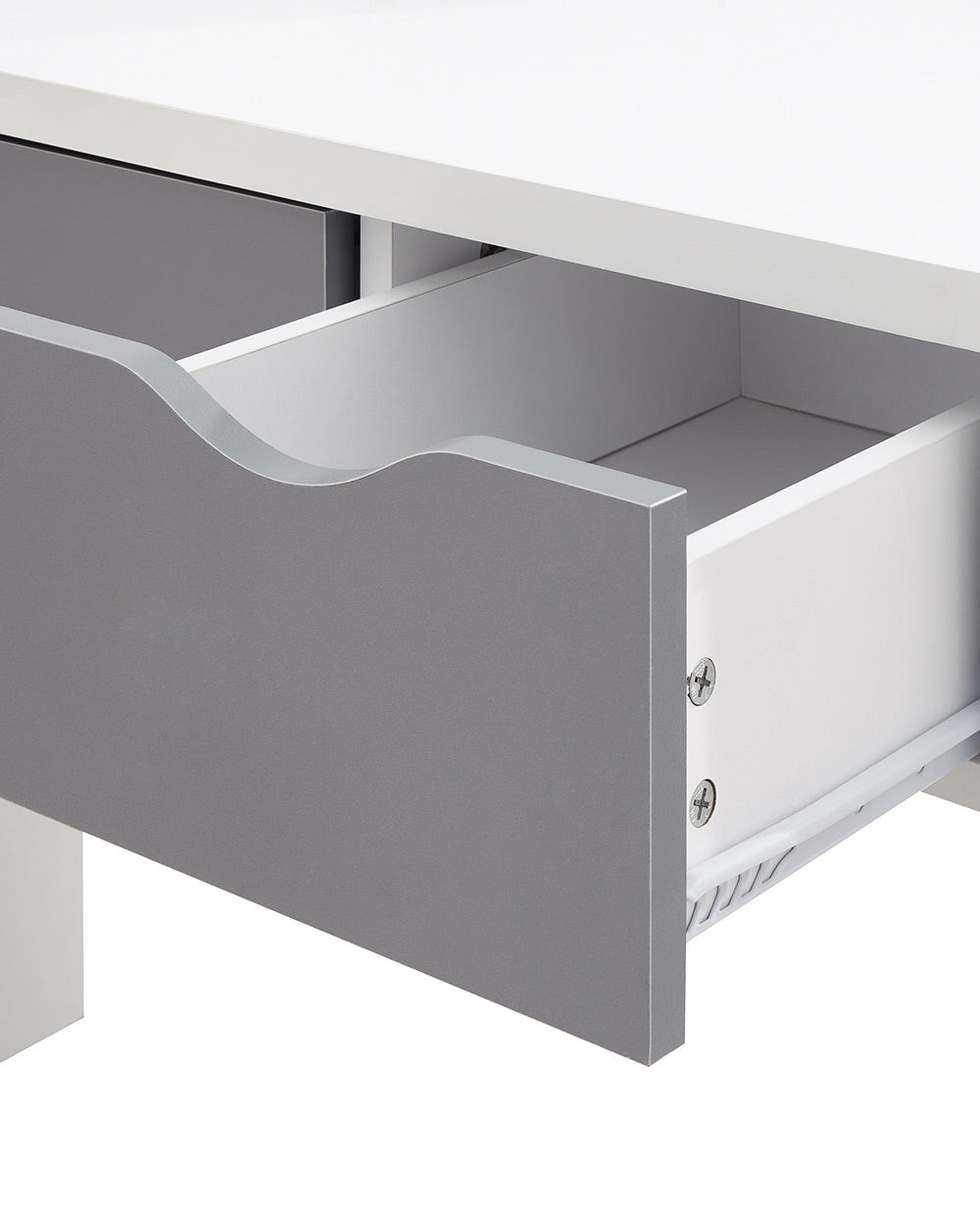 close up of the cut out handle drawers on a white bakground