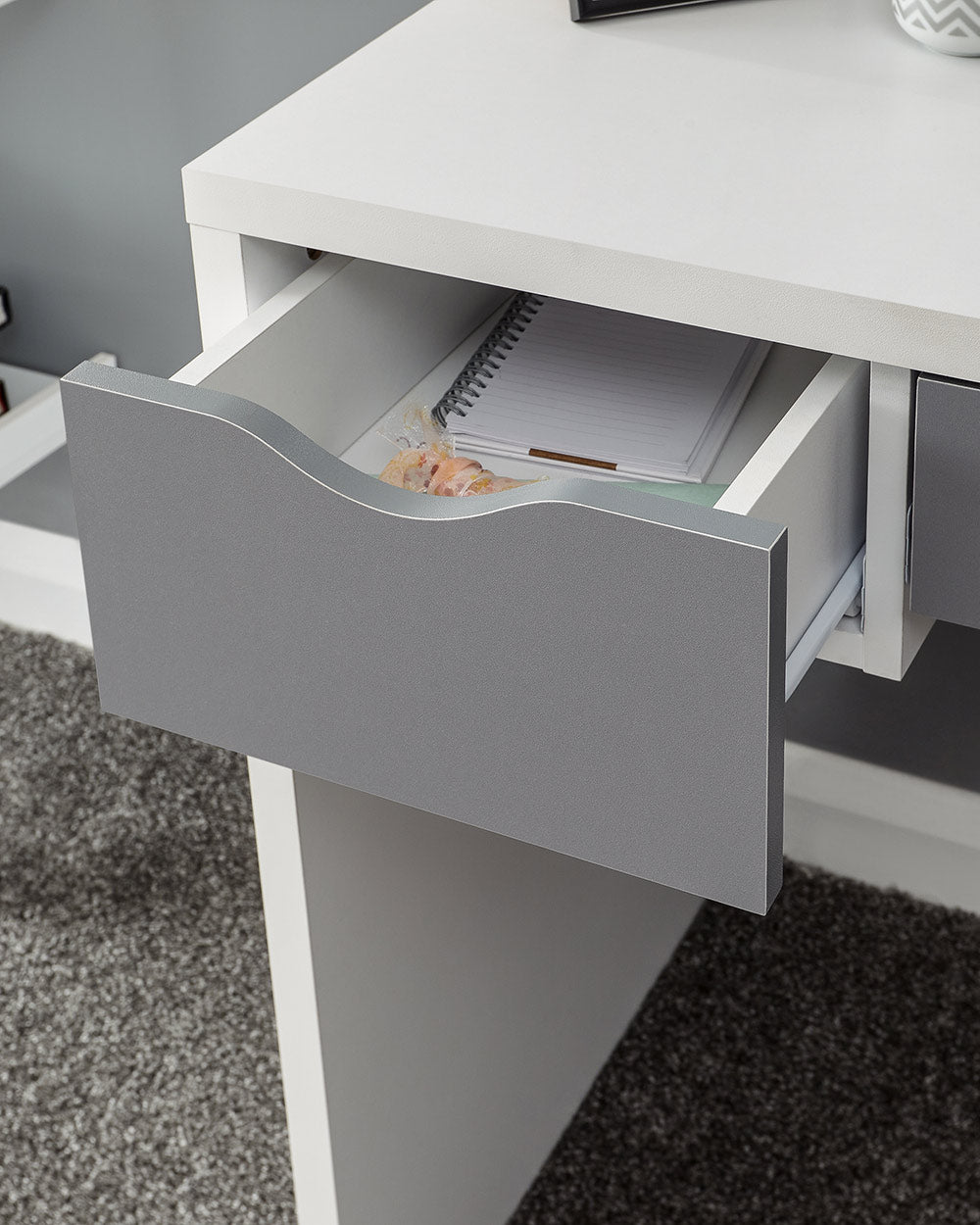 close up of the cut out handles on this dressing table set
