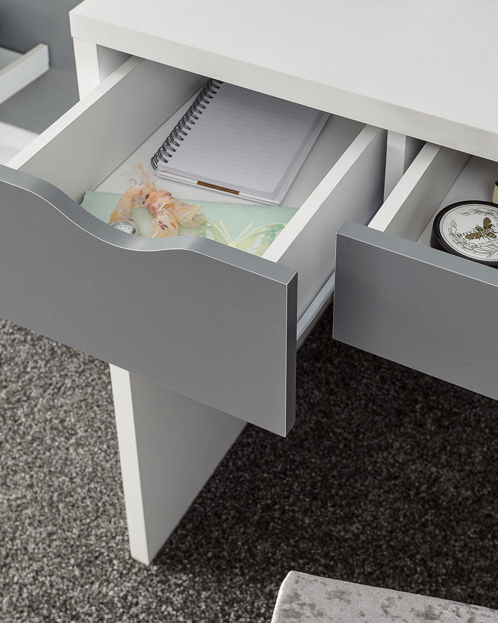 close up of the drawers on this dressing table