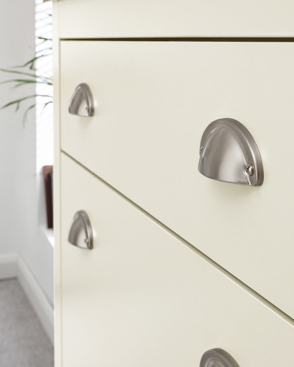 lancaster shoe storage cabinet in cream in a lifestyle setting close up of the brushed silver handles
