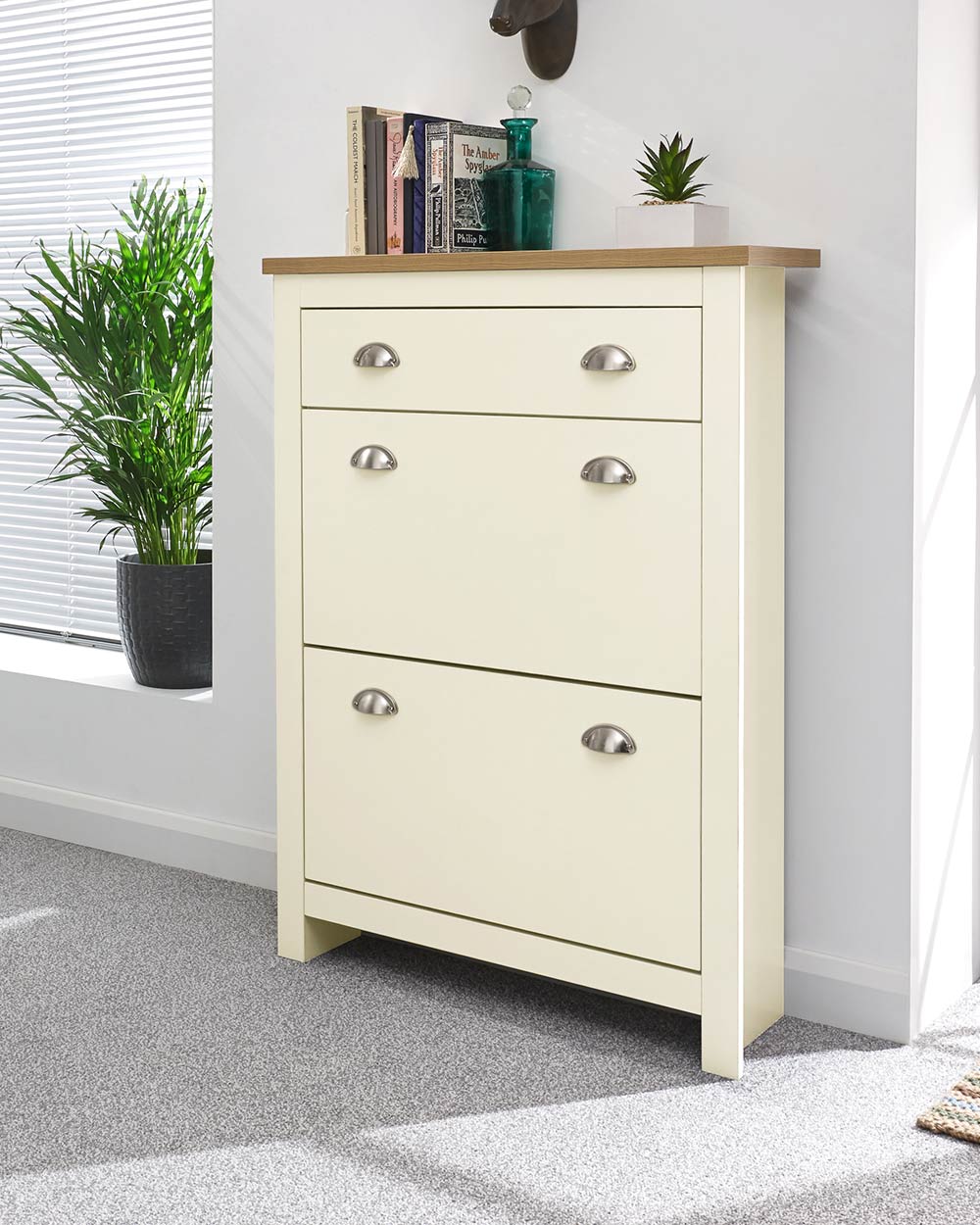 lancaster shoe storage cabinet in cream in a lifestyle setting.