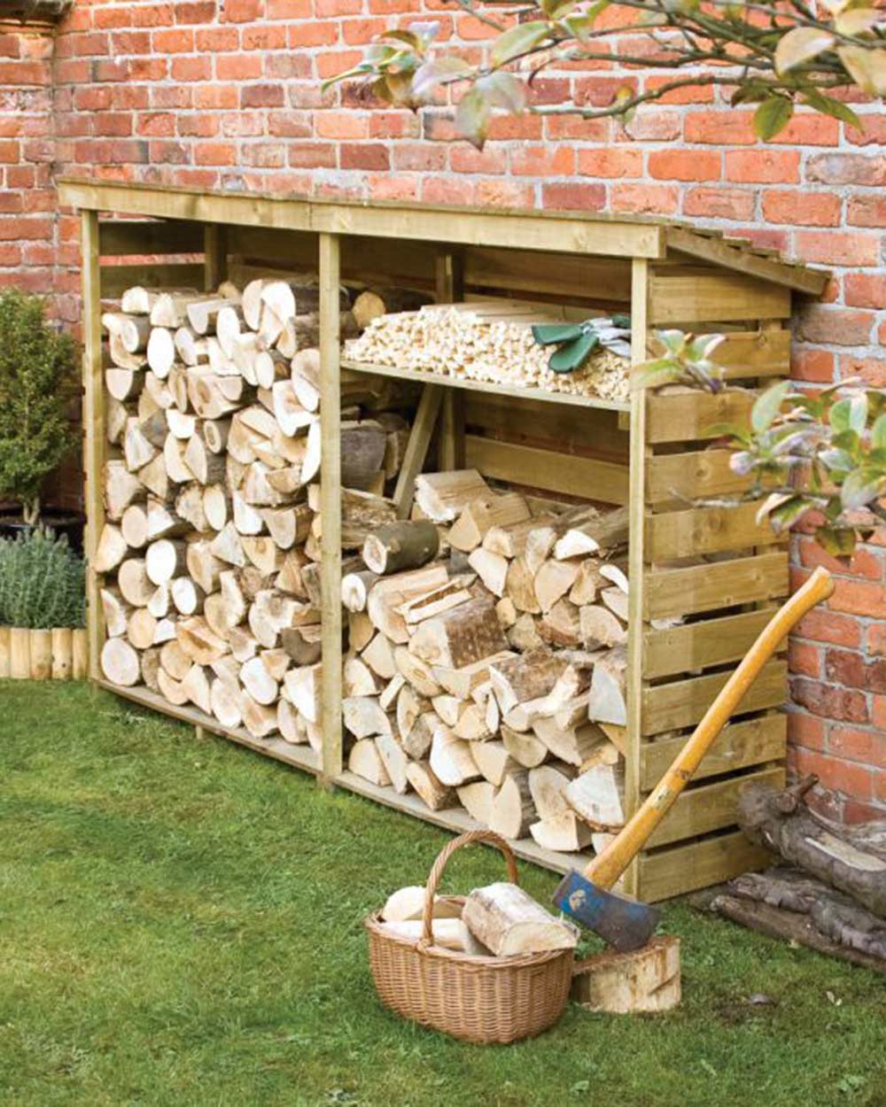 garden outdoor large wood store wood storage filled with wood and kindling in a garden, with a basket and axe in front of it