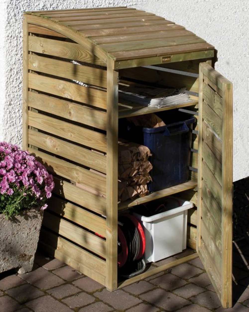rowlinson box store garden storage shed in a garden filled with recycling boxes and garden tools