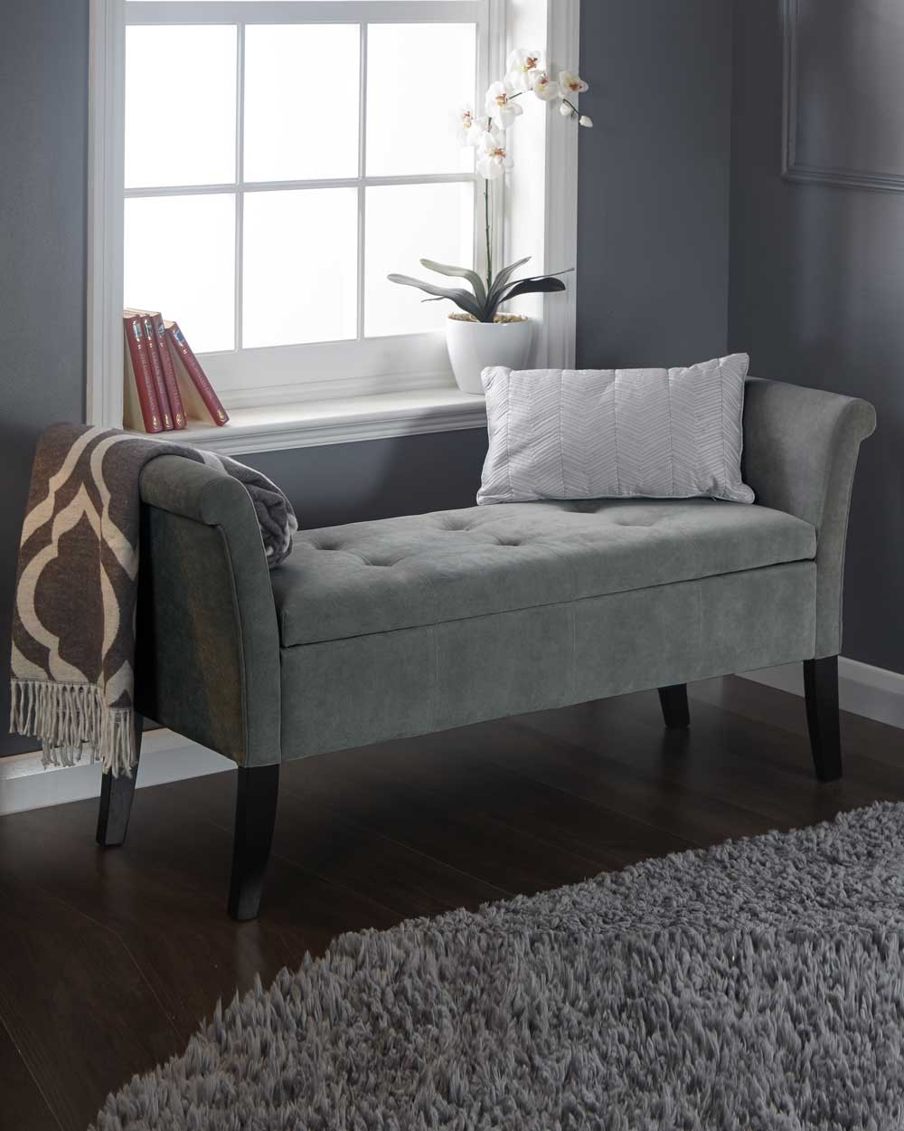 This storage bench is upholstered in beautiful grey chenille fabric. Concealing deep-tufted seating which emphasises the bench's crisp profile. Seating up to 2 persons, this bench is not only practical but stylish.