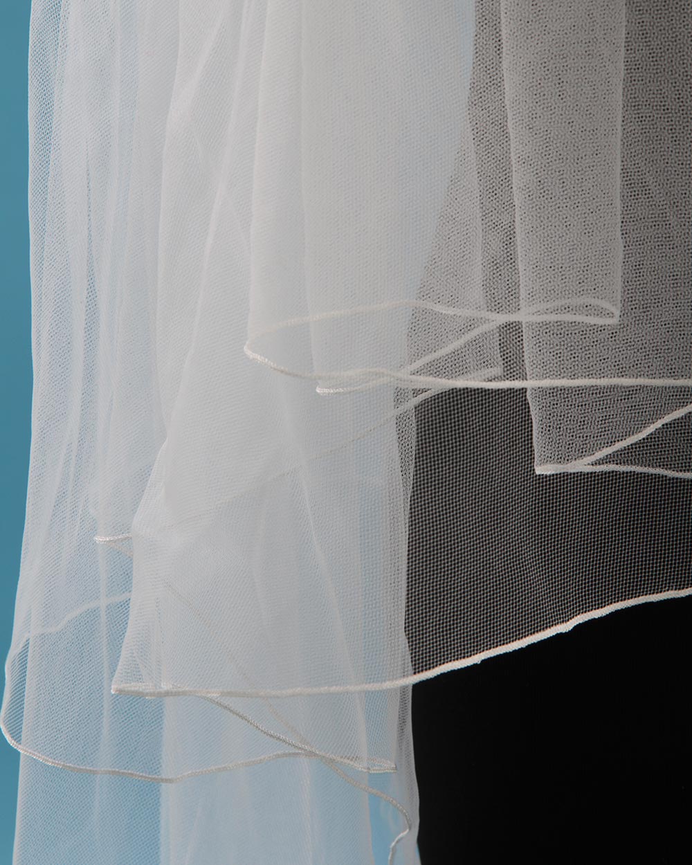 Lend a fabulous floral touch to your bridal look with this beautiful wedding veil. This delicate ivory tulle wedding veil is embellished with a floral lace motif edge.